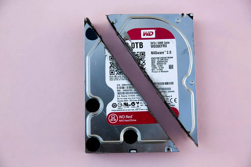 A hard disk drive with its metal cover partly removed